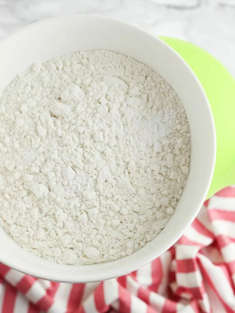 Add flour and baking soda to mason jar.
