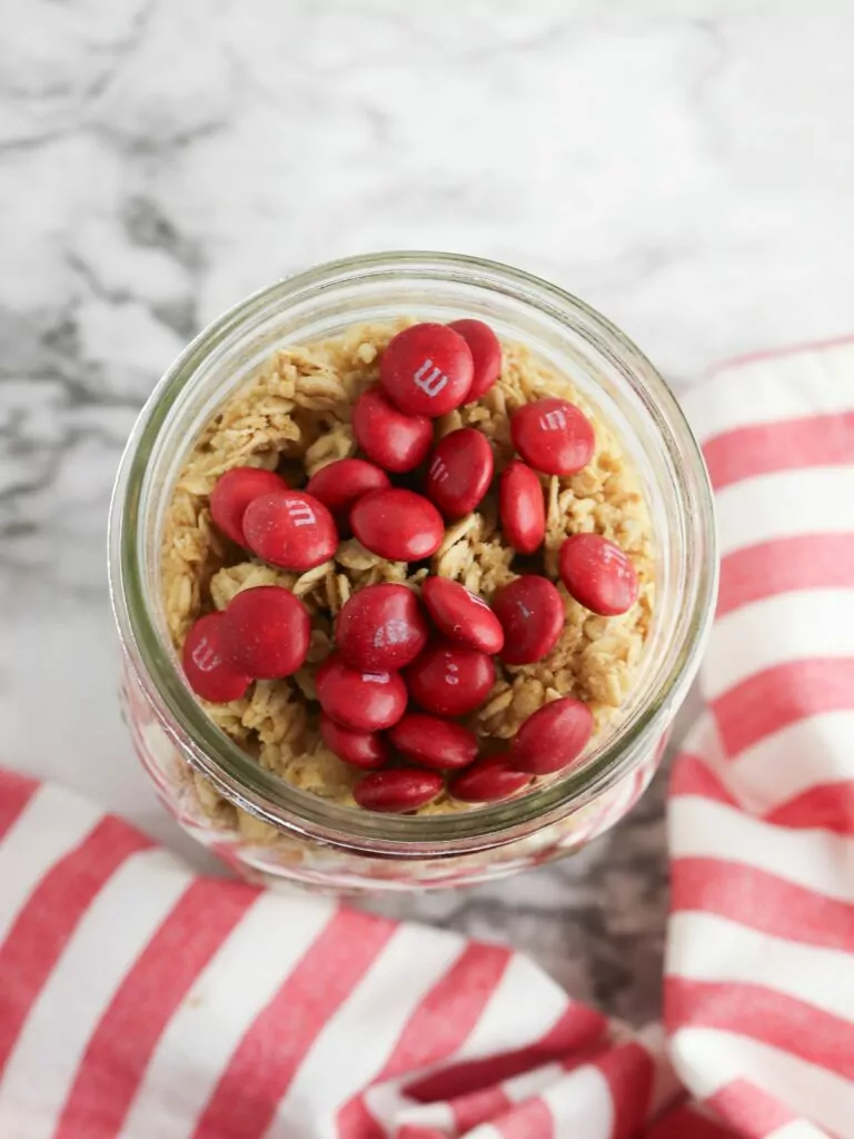 Add red M&Ms to jar.